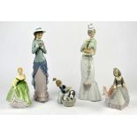 Three Lladro figures of ladies, together with a Lladro figure of a child washing a dog and a