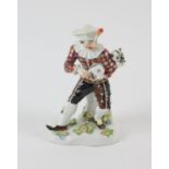 Meissen figure of a Harlequin, late 19th Century, blue crossed swords mark, pressed numbers to base,