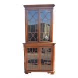 Early 20th century astregal glazed two sectioned satin and rosewood banded corner cupboard,