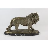 Cast metal figure of a lion on black marble base, 50cm x 16cm x 30cm SOLD ON BEHALF OF OXFAM