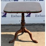 A tilt top mahogany table, 19th Century, with snap release top, on turned column, with tripod base,