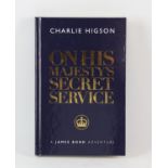 James Bond hardback book, On His Majesty's Secret Service signed by Charlie Higson.