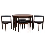 HANS OLSEN FOR FREM ROJLE, a teak circular extending dining table, 74cm high x 106cm diameter,