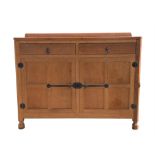 WORKSHOP OF ROBERT 'MOUSEMAN' THOMPSON (BRITISH, 1876-1955), an oak sideboard, with canted corners,