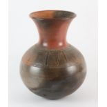 TONY OGOGO (NIGERIAN, B.1953); a burnished and smoke fired earthenware vessel, with a band of