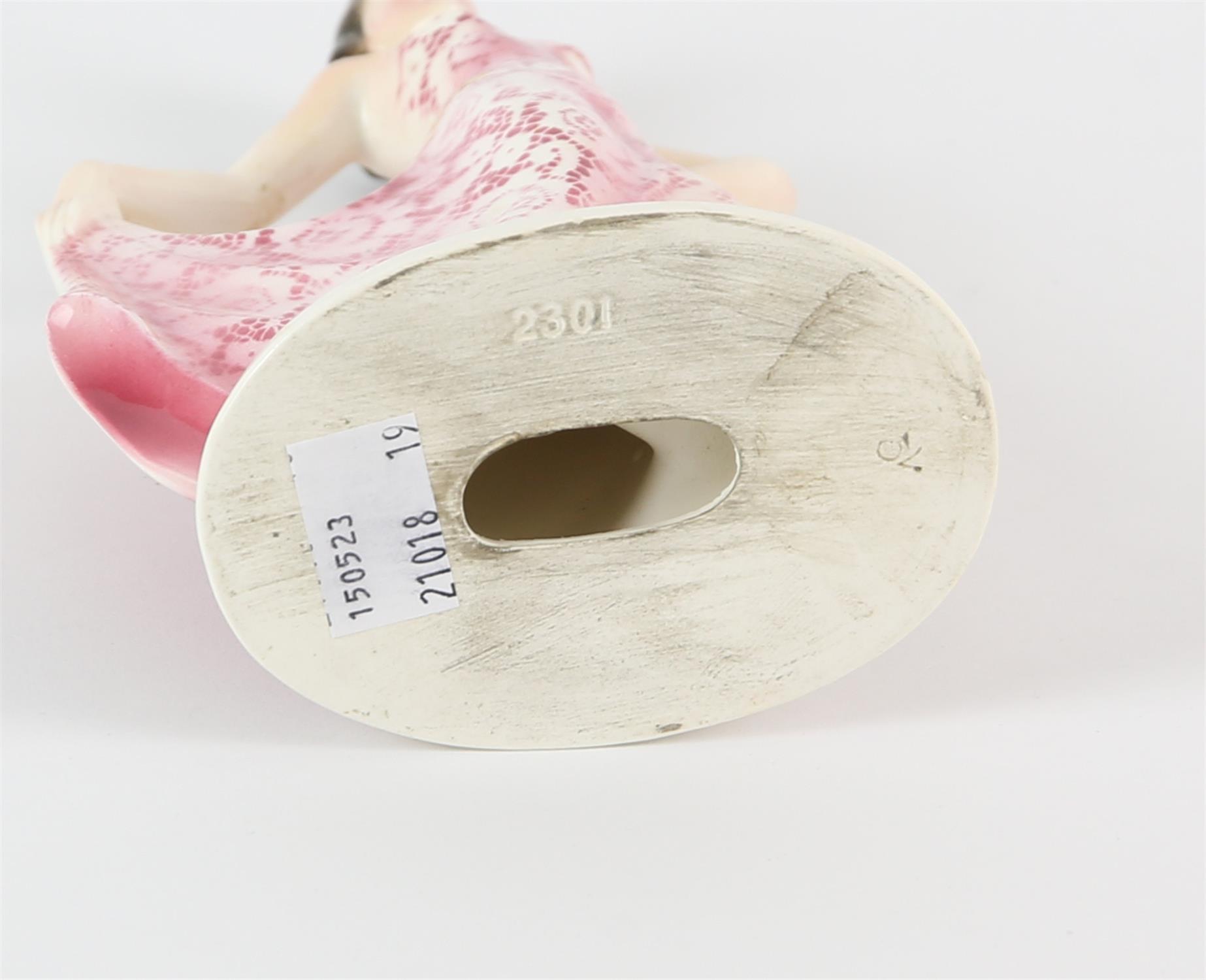 IN THE MANNER OF KATZHUTTE, a pottery figure of a dancing lady, wearing a pink and white dress, - Image 3 of 3