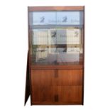 SVEND DYRLUND, a Santos rosewood office cabinet, the upper tier with glass sliding doors,