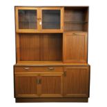G PLAN, a display cabinet / sideboard, glazed doors over cupboard door above single drawer over two