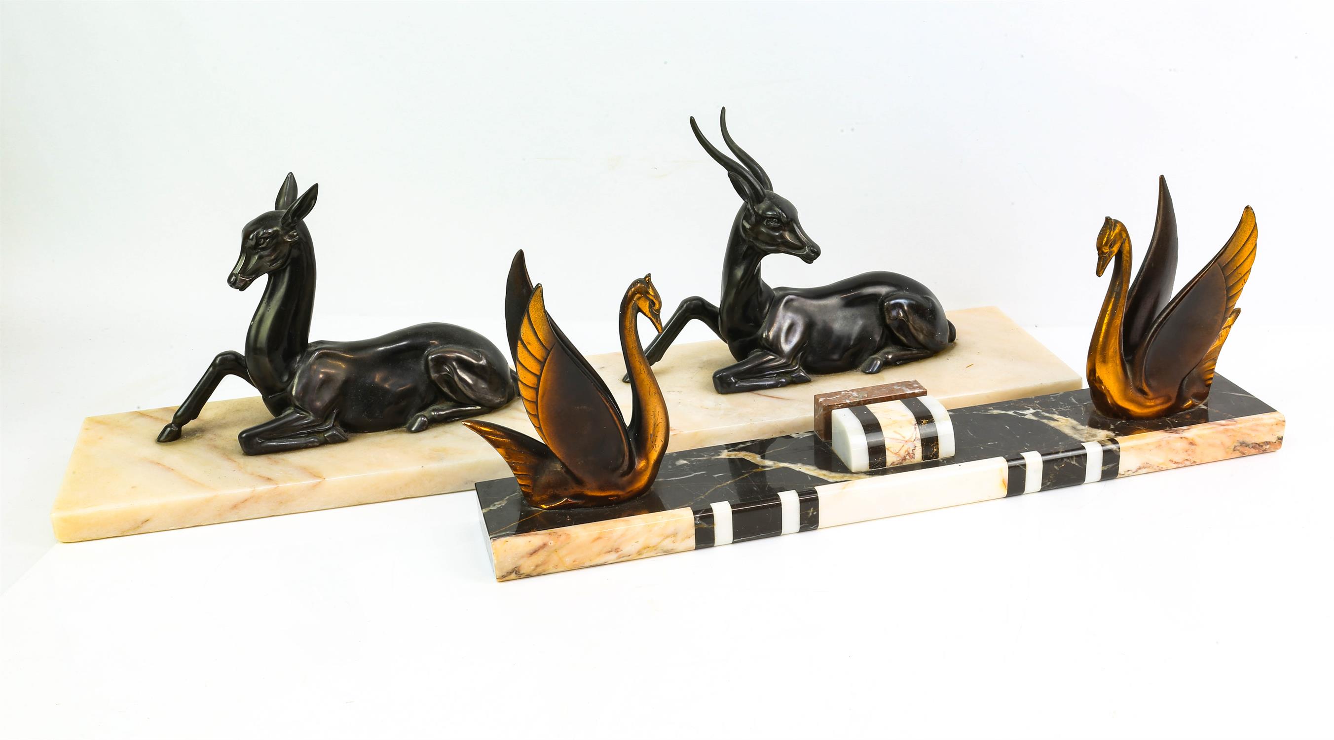 ART DECO, a silvered spelter figure group of an antelope and hind, on a rectangular onyx base,