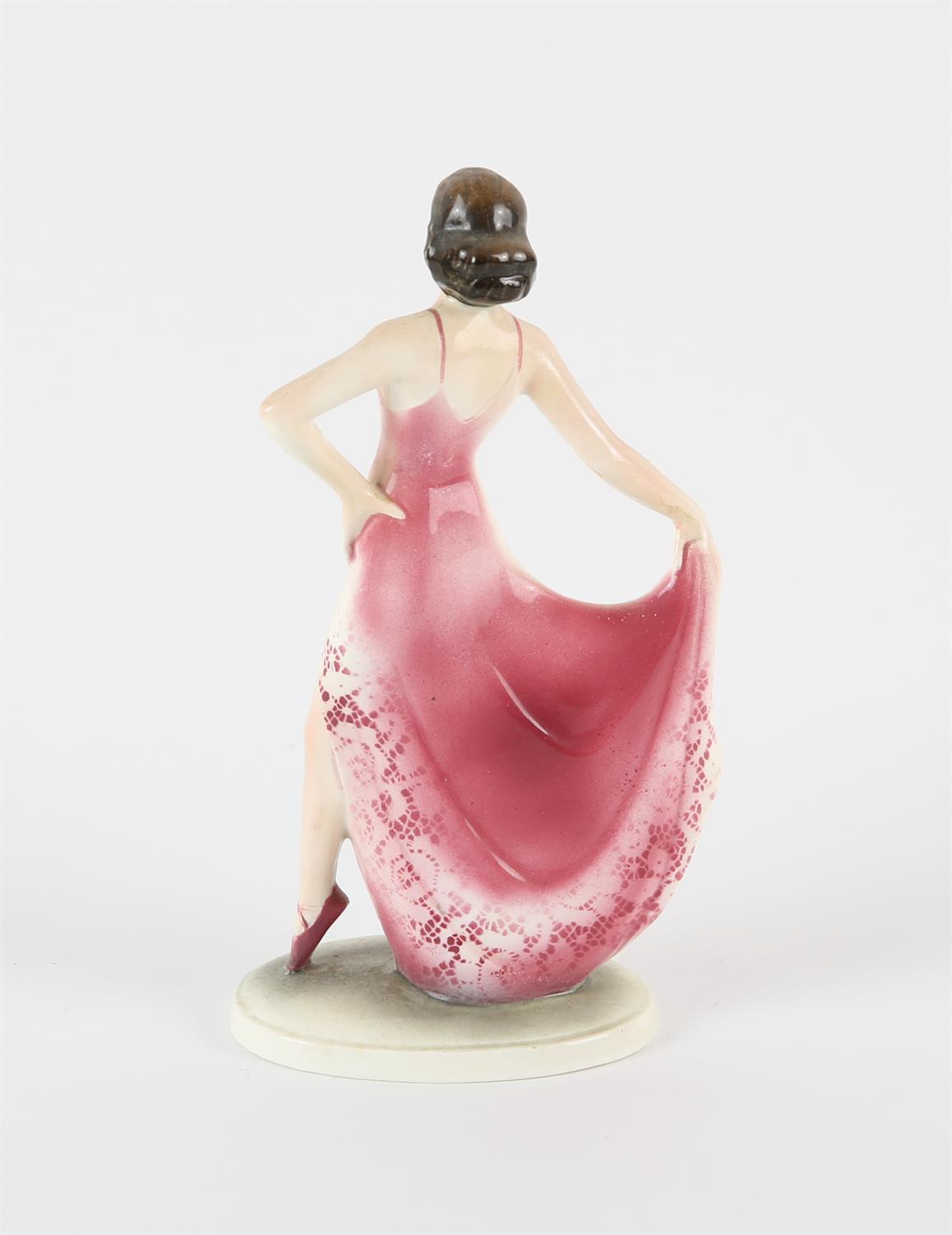 IN THE MANNER OF KATZHUTTE, a pottery figure of a dancing lady, wearing a pink and white dress, - Image 2 of 3