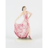 IN THE MANNER OF KATZHUTTE, a pottery figure of a dancing lady, wearing a pink and white dress,