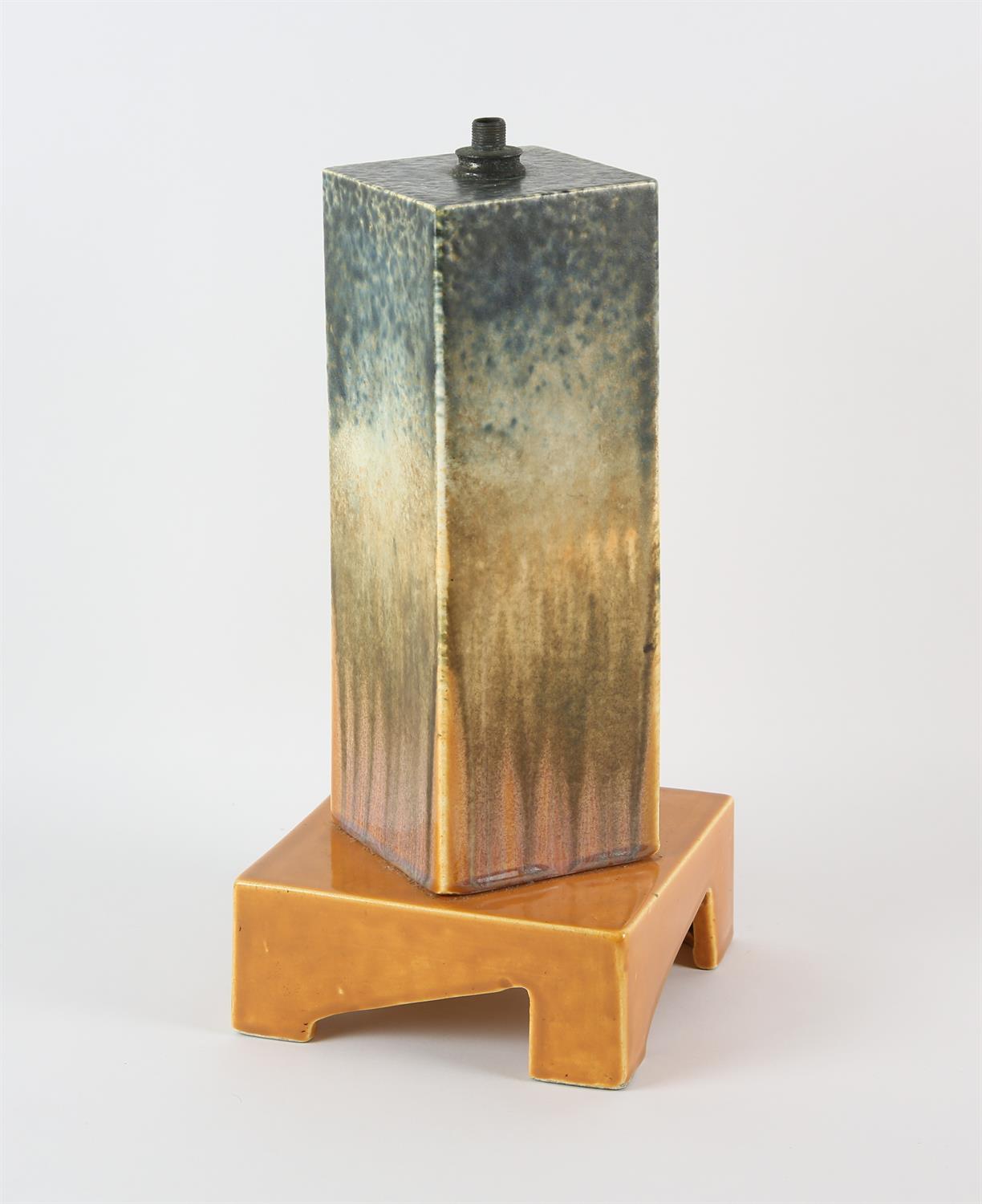 RUSKIN, ENGLAND, a rectangular pottery lamp, on square base, decorated with orange and blue glazes,