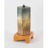 RUSKIN, ENGLAND, a rectangular pottery lamp, on square base, decorated with orange and blue glazes,