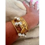 A PHILIPPE FERRANDIS, Paris, wide cuff bracelet/bangle, with gold plating and paired pearl beads