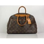A LOUIS VUITTON "DEAUVILLE" monogram handbag carrying serial no. VI 1913 with detailed receipt from