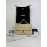 CHANEL medium classic flap handbag in cream lambskin leather with gold tone hardware with original