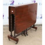 Victorian mahogany Sutherland table, the twin flap top on bobbin turned base with brass castors,