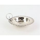 Edwardian Silver tea strainer with scrolled border, Birmingham, 1908