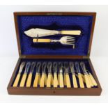A silver plated canteen of twelve fish knives and forks, with servers, late 19th/early 20th Century