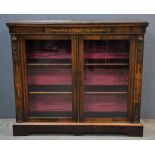 Victorian walnut and gilt metal mounted bookcase, with glazed doors enclosing shelves,