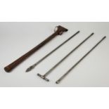 A three section steel tool with a slotted spear tip and T-bar, leather carry case