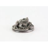 Silver covered model of a frog by country Artists