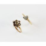 A three stone diamond ring set with old and single cut diamonds, in 18ct yellow gold and platinum,