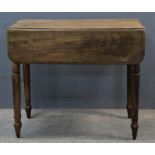 Mahogany pembroke table, 19th Century, with two flap top, above frieze drawer, on turned legs,