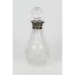 A cut glass bottle with silver mount by Mappin and Webb 1998 Birmingham. H 20.5cm