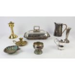 Large quantity of silver plate including tureens, candelabra and trays, with a brass chamber stick