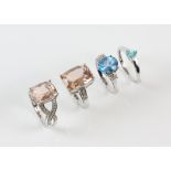 Four gem set rings, including two morganite rings, a blue topaz ring, all size N,