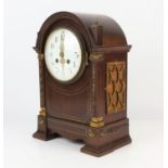 Mahogany mantle clock with gilt metal mounts, the two train movement striking on a coiled gong,