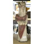 A pottery figure of a Queen, holding a pot, impressed mark to interior, for use as a candlestick,