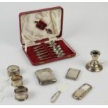 Small silver items to include cigarette case, card case, tea spoons and napkin rings,