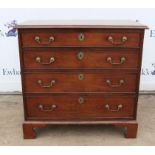 Mahogany chest of drawers, four graduated drawers, on brass handles and escutcheons on bracket feet,