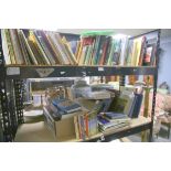 Collection of books on various subjects, including cycling, aviation, art and of local interest,