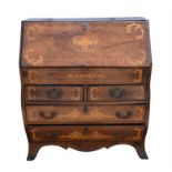 A Dutch walnut and marquetry ‘bombe’ bureau, early 19th Century, with all front enclosing a fitted
