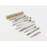 Selection of 10 silver and silver plate pencils by a variety of makers, one with a built in