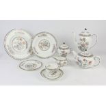 A Wedgwood Kutani pattern part dinner and coffee service, with ten dinner plates, twelve soup bowls,