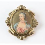 A portrait swivel brooch, oval swivel portraits of women, in a gold plated frame, measuring 67.