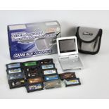 NINTENDO Gameboy Advance SP bundle + 16 loose games in a tin Includes: Gameboy Advance SP Console
