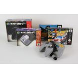 AMENDED DESCRIPTION Nintendo 64 items. An N64 rumble pak (boxed), 2 N64 contollers (black / boxed)