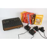 ATARI 2600 console with accessories and 8 games Accessories include: paddle x2 and classic