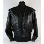 Elton John - a Claude Montana black leather jacket, apparently unworn, with black lining,