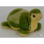 A Steiff tortoise, green with Steiff label. 20cm long
