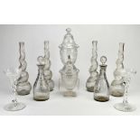 Pair of Georgian glass decanters and stoppers, 25cm high, two glass vases with covers, 19th Century,