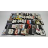A large assortment of cassette tapes, varying from audio cassettes, 8-track tapes,