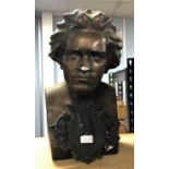 A bronzed plaster bust of Beethoven, 46cm high, together with a bois d' Orcey plaque of Beethoven
