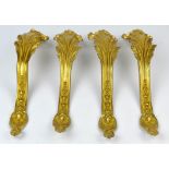 Set of four gilt metal scrolling furniture mounts, 20th Century, of acanthus form, 36cm long (4)