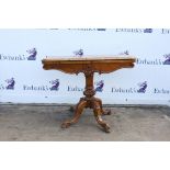 Victorian walnut card table, with circular baize lining, on turned column, on curving florally